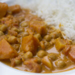 vegan slow cooker chickpea curry on a plate with rice