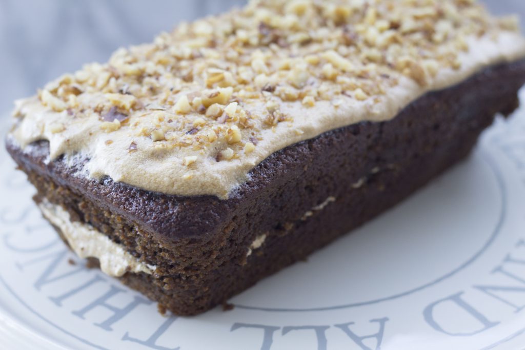 Delicious Vegan Coffee and Walnut Loaf Cake Recipe 9 a vegan coffee and walnut loaf cake on a cake stand
