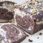 a vegan marble cake, sliced open to show the swirls inside