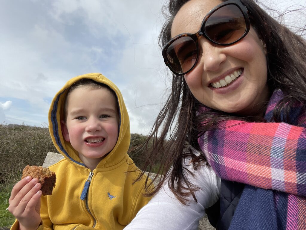 Fudgy Chocolate Chip Vegan Blondies Recipe 198 Ali and her son enjoying eating chocolate chip vegan blondies on a walk.
