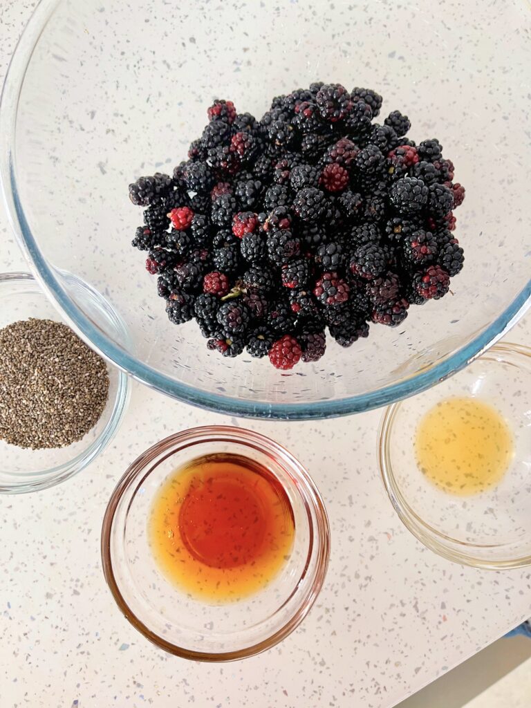 Chia Blackberry Jam Recipe (Vegan Blackberry Jam) 125 4 bowls containing blackberries, maple syrup, chia seeds and vanilla extract