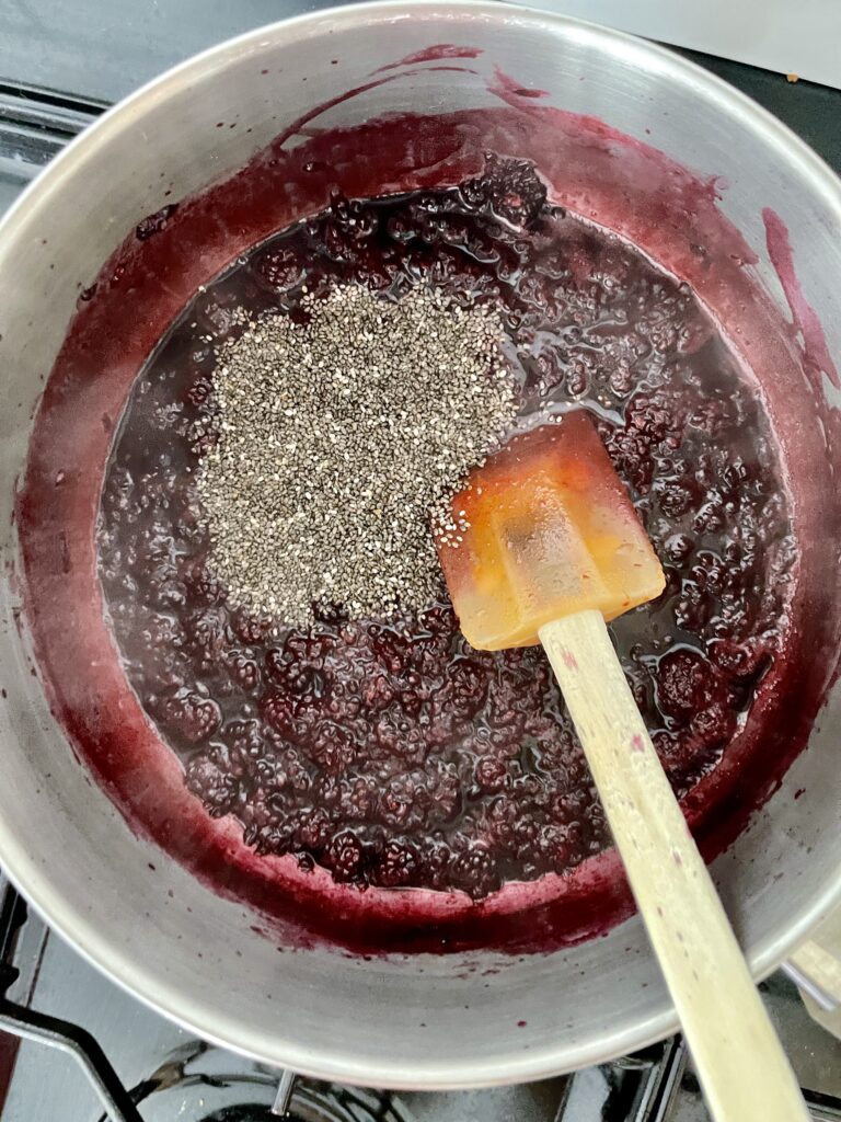 Chia Blackberry Jam Recipe (Vegan Blackberry Jam) 127 a saucepan containing blackberry chia jam being made