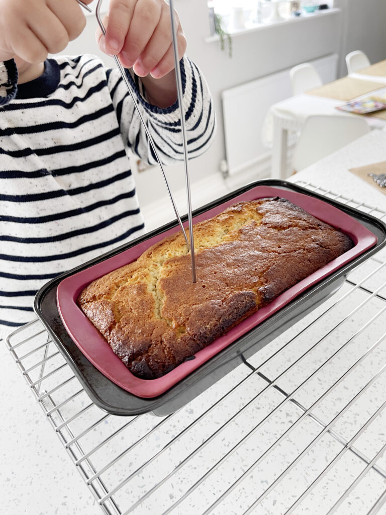 The Best Easy Vegan Lemon Drizzle Cake Recipe 215 piercing holes in a lemon drizzle cake