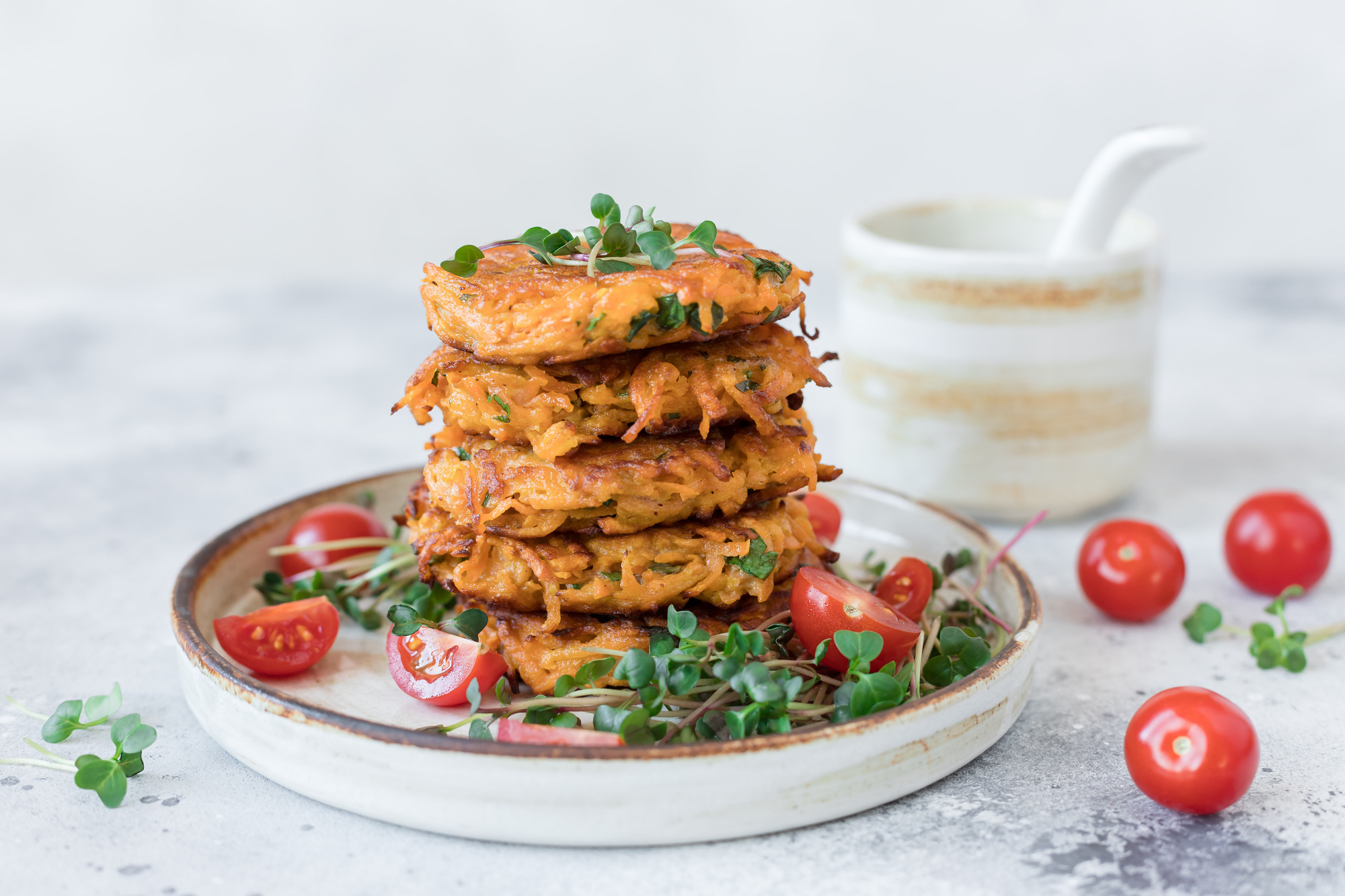 Stack of vegetable fritters with garnish