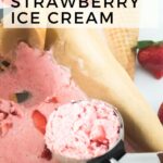 A scoop of vegan strawberry ice cream rests on a parchment-lined surface with fresh strawberries and a waffle cone in the background. The text on the image proudly announces "Vegan Strawberry Ice Cream.