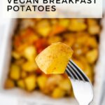 A fork holds a piece of roasted potato in front of a dish filled with more vegan breakfast potatoes. The text reads: "Crispy Roasted Vegan Breakfast Potatoes.