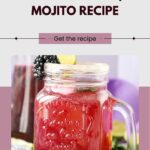 Image of a mason jar with a blackberry mojito. The jar is filled with a reddish drink, topped with blackberries and a slice of lemon. Text reads "Blackberry Mojito Recipe." Website: wemadethisvegan.com.