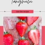 A cluster of candied strawberries gleam with a clear glaze, artfully displayed on a wooden surface. Text reads: "Strawberry Tanghulu" and "Get the recipe" with a website link included.