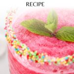 Close-up of a refreshing watermelon slushie in a glass with a colorful sprinkled rim, garnished with two mint leaves. The text at the top reads "Delicious Watermelon Slushie Recipe.