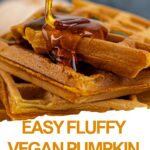 A stack of vegan pumpkin waffles with syrup being poured on top. Text reads: "Easy Fluffy Vegan Pumpkin Waffles – perfect for a cozy breakfast!.