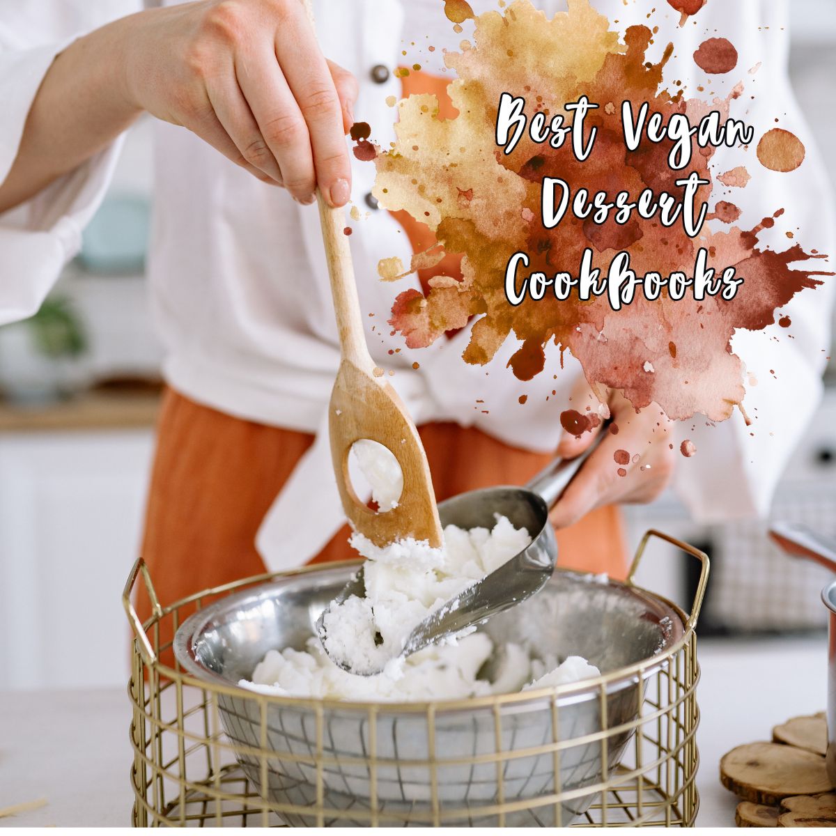 A person scoops a white mixture into a bowl with a wooden spoon; text reads "Best Vegan Dessert Cookbooks" over a watercolour background, perfect for discovering new vegan recipes.